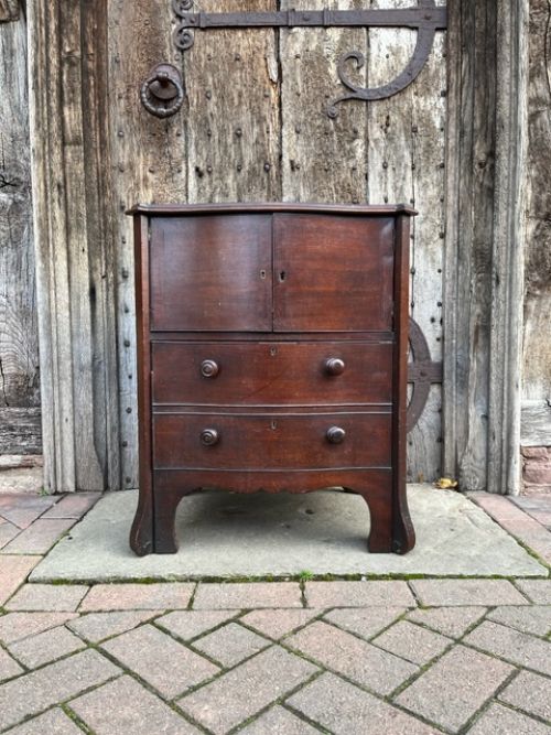 18th century mahogany serpentine bedside cabinet
