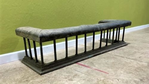 a late 19th century brass club fender with upholstered seat