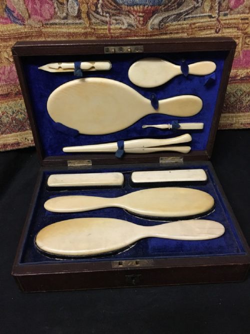 leather travelling case fitted with ivory back accessories