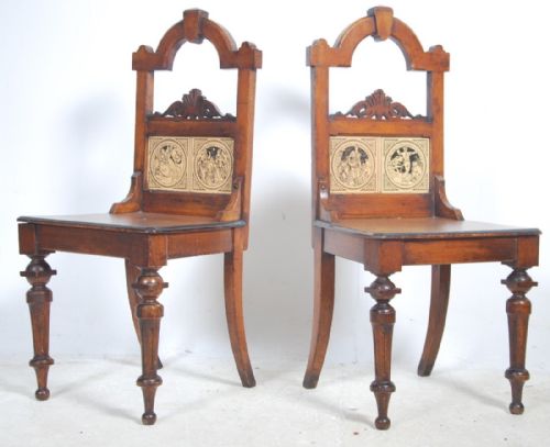 pair of oak hall chairs with with shakespeare tiles inset