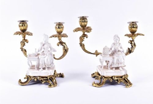 pair of biscuit figures mounted on double candlesticks and stand