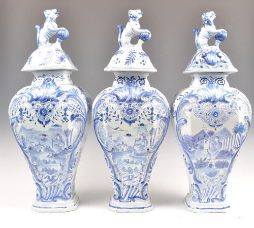 garniture of delft vases and cover