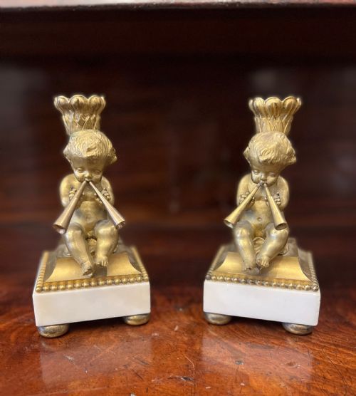 pair of bronze ormolu cherub candlesticks