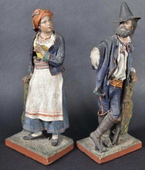pair of neopolitan painted cork and papiermch figures