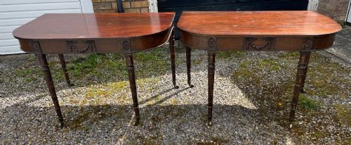 a pair of c1800 d end tables with ribbon swag carving and paterae