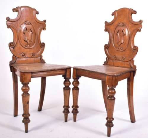 pair of oak armorial hall chairs