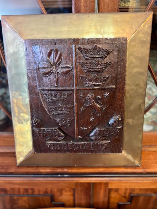 c19th oak crest inset into a brass frame