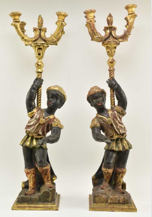 pair of carved blackamoor figures as candelabras