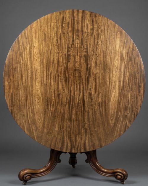 a large circular mahogany table