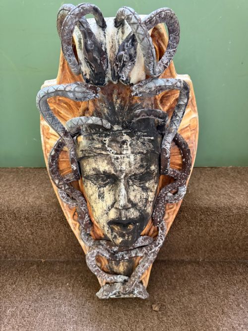 highly decorative early c20th carved stone and leadmounted medusa head wallbracket