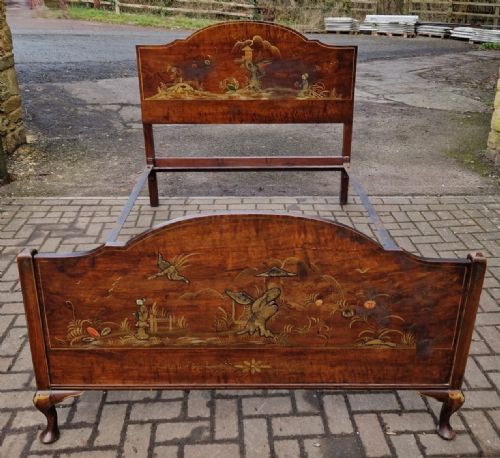 fig 2. A four-piece Edwardian walnut bedroom suite decorated with gold Chinoiserie scenes, consisting of a bedstead, tall wardrobe, dressing table, and chest of drawers.