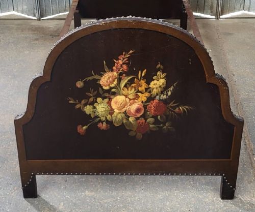 A single wooden bedstead featuring arched dark leather headboard and footboard panels decorated with hand-painted floral still life arrangements. View III
