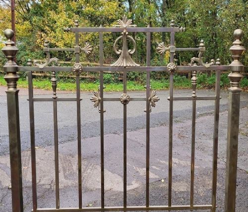 Victorian double brass bedstead featuring barley twist corner posts, decorative cast scrollwork, and original castors. View III