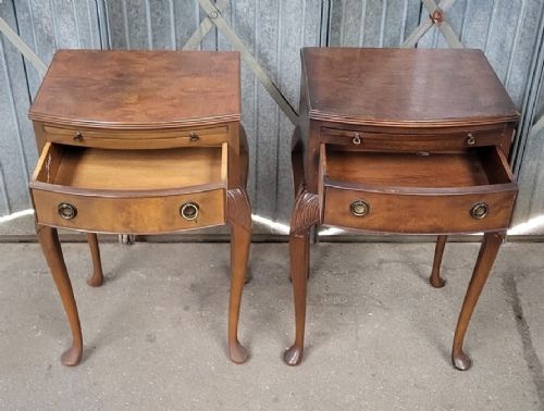 A pair of Queen Anne style warm brown walnut bedside tables featuring carved cabriole legs, single drawers, and pull-out brush slides. View II