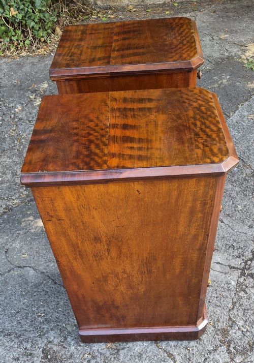 A pair of matching tall Victorian mahogany bedside chests featuring four drawers with turned wooden knobs and chamfered corners. View III