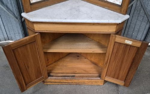 A Victorian walnut corner washstand featuring an upper corner splashback with patterned ceramic tiles, a white marble surface, and a two-door cabinet below. View III
