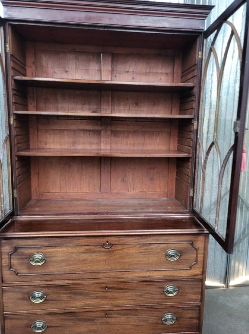 A Georgian mahogany secretaire bookcase featuring two upper glazed doors with Gothic arch astragal glazing bars above a chest of drawers. View II