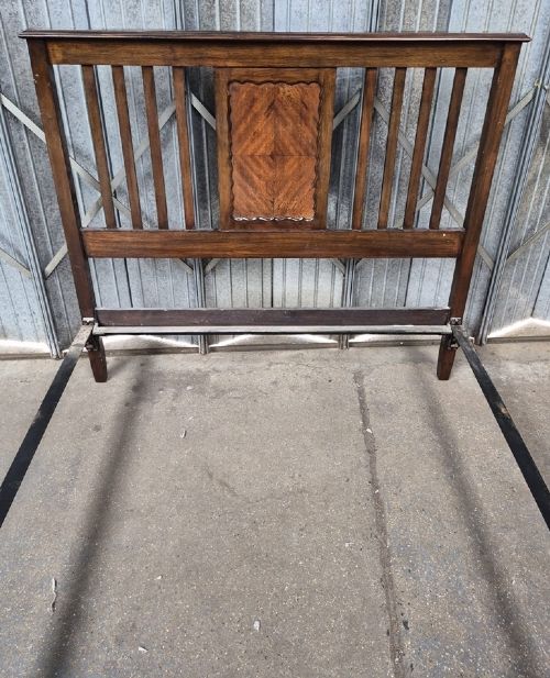 An Edwardian mahogany double bedstead featuring vertical slatted sides and a central parquetry chevron panel on both the headboard and footboard. View II