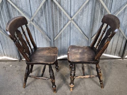A pair of Victorian Thames Valley elm kitchen chairs with dark timber finish, turned legs, solid contoured seats, and pierced central back splats. View II