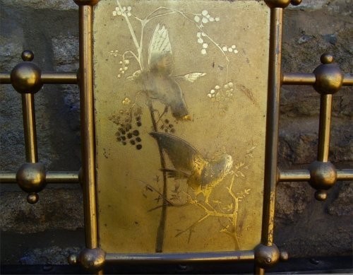 A Victorian king-size brass bedstead featuring decorative vertical spindles, turned ball finials, and a central engraved brass plaque. View III