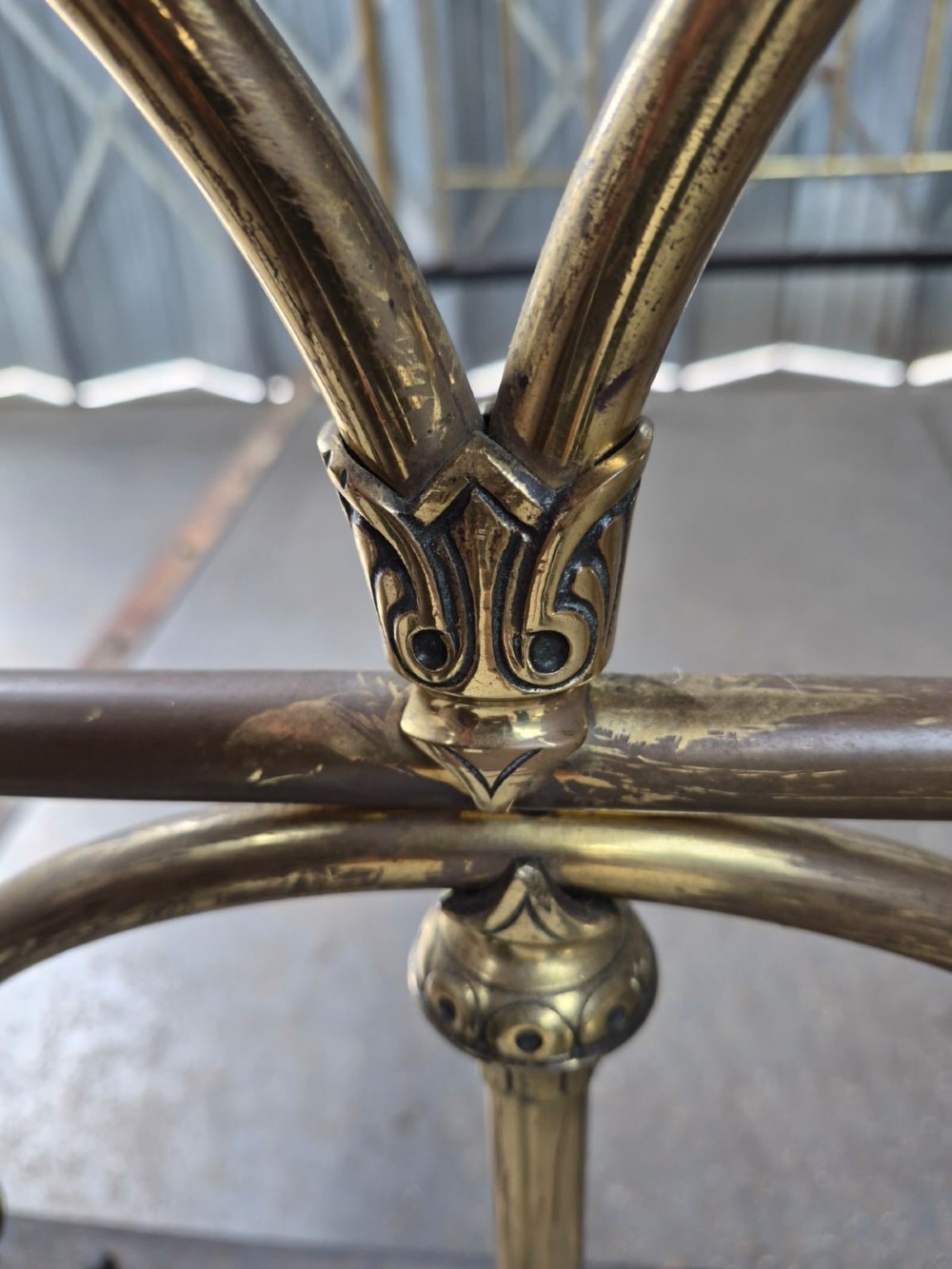 Victorian brass king-size bedstead featuring Gothic tracery arch designs on the headboard and footboard with decorative corner finials. View III