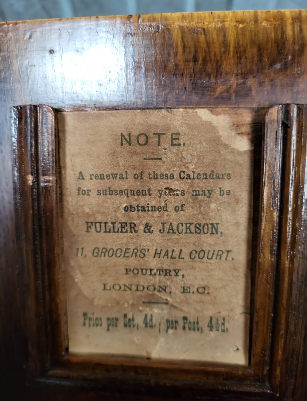 A slanted Victorian oak desk box with double doors and a central brass keyhole escutcheon. View IV