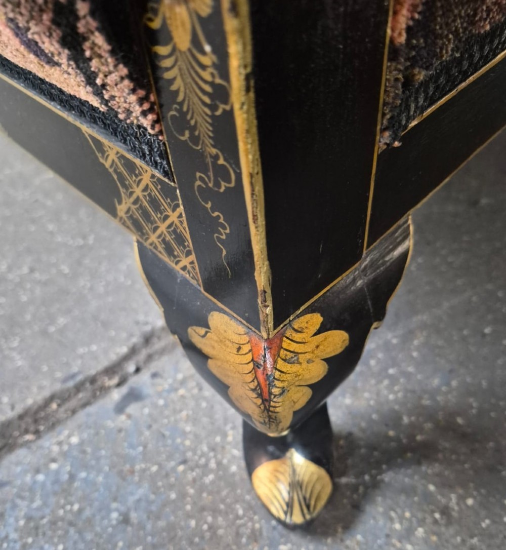 A three-piece Edwardian seating suite comprising a central two-seater settee and two matching armchairs with black lacquered frames adorned with gilded Chinoiserie patterns and pink floral pattern fabric upholstery. View VI