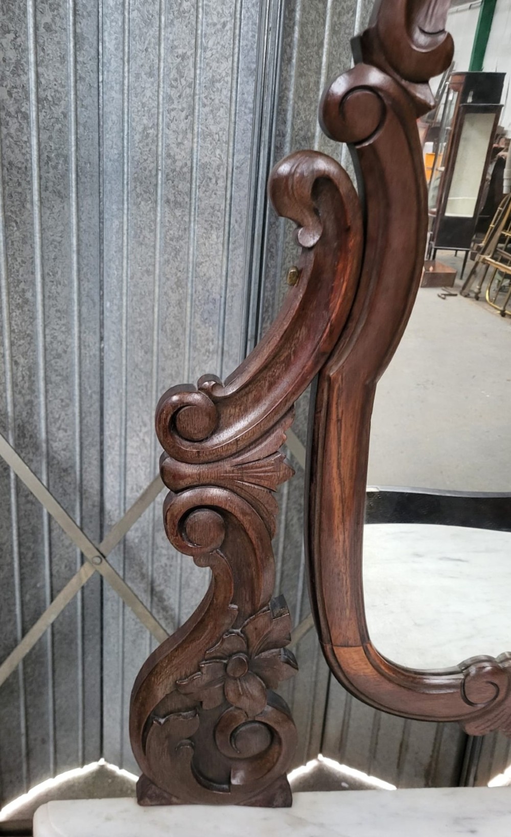 A French walnut dressing table featuring an attached carved mirror, a white marble surface, a single drawer, and cabriole legs. View V