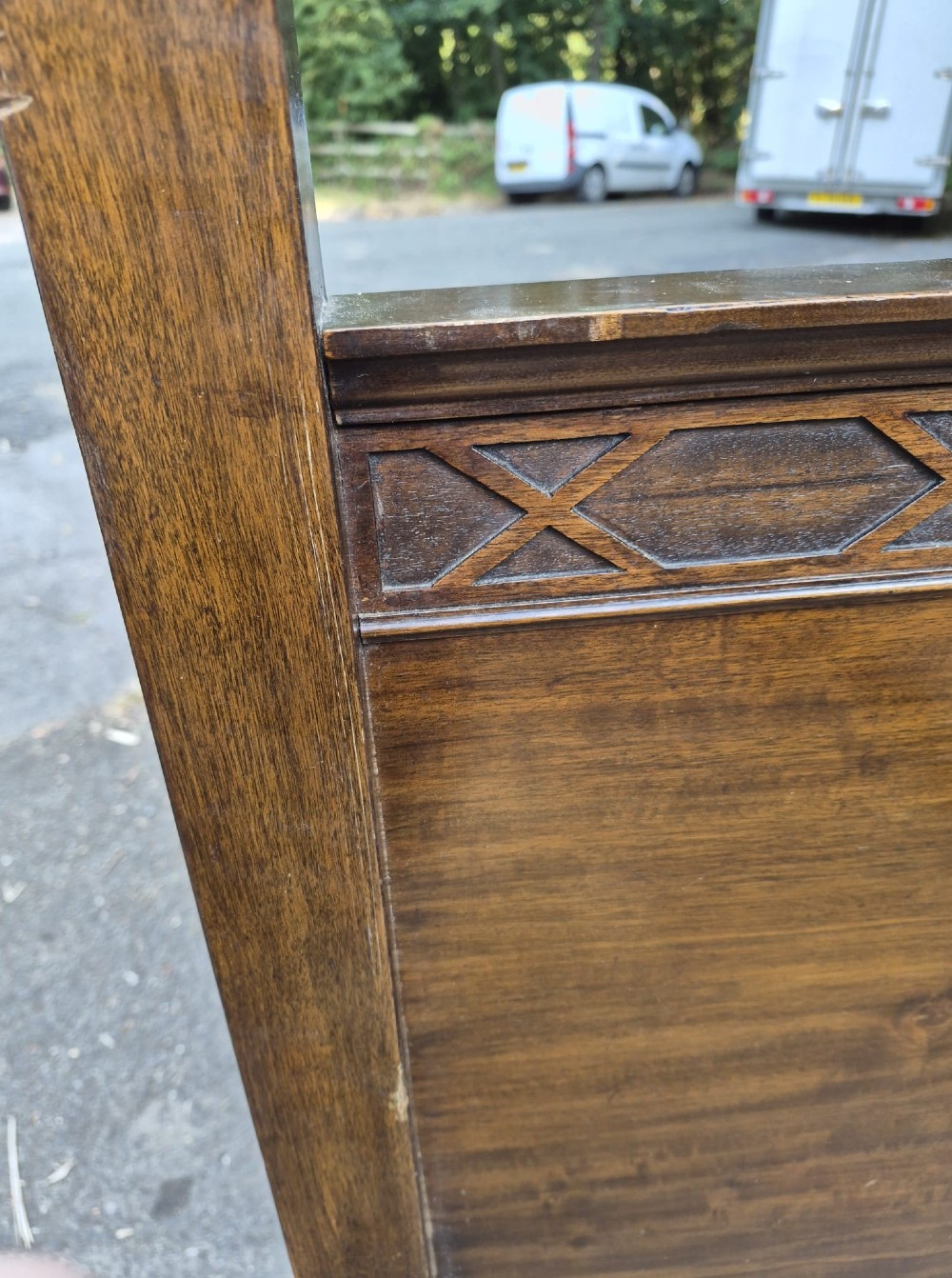 An Edwardian mahogany four-poster bedstead featuring reeded upright posts, a geometric frieze cornice, and a simple panelled headboard. View II