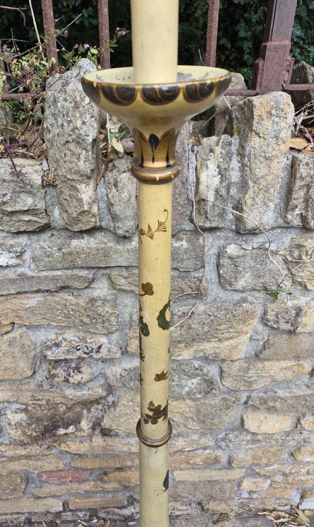 An Edwardian Chinoiserie standard lamp featuring a cream painted turned wooden stem decorated with hand-painted foliage motifs and a round weighted base. View II