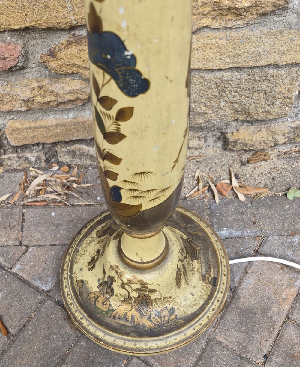 An Edwardian Chinoiserie standard lamp featuring a cream painted turned wooden stem decorated with hand-painted foliage motifs and a round weighted base. View III