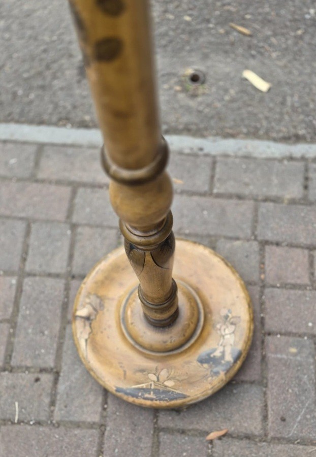 An Edwardian Chinoiserie standard lamp featuring a hand-painted turned wooden column, a circular stepped base, and brass fittings. View II