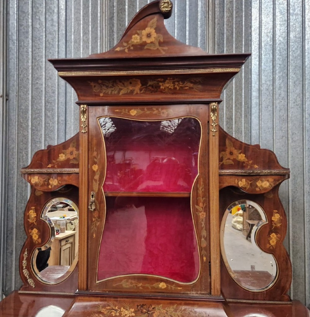 A Victorian inlaid walnut side cabinet featuring a mirror-backed upper section with a central glazed door, floral marquetry inlay, and cabriole legs. View II