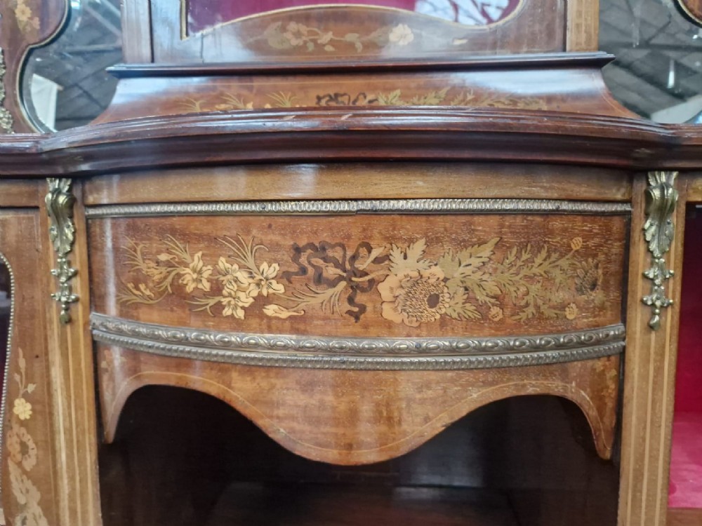 A Victorian inlaid walnut side cabinet featuring a mirror-backed upper section with a central glazed door, floral marquetry inlay, and cabriole legs. View IV