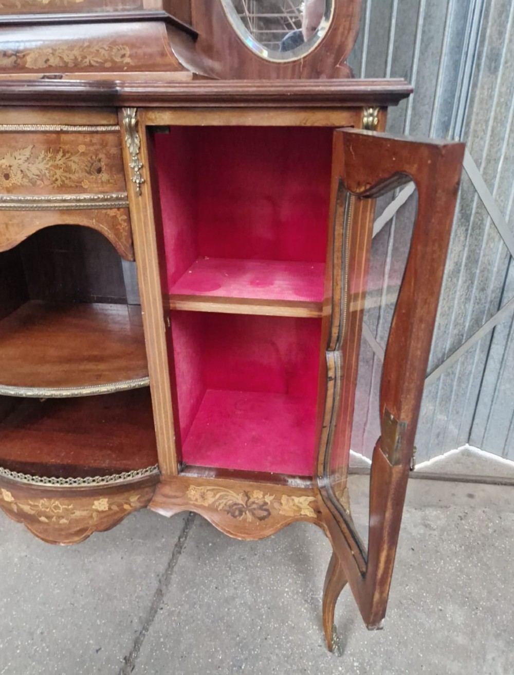 A Victorian inlaid walnut side cabinet featuring a mirror-backed upper section with a central glazed door, floral marquetry inlay, and cabriole legs. View VII