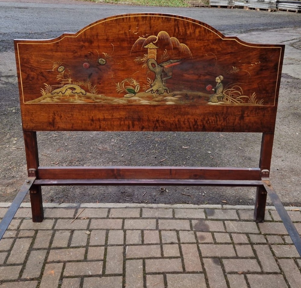 A four-piece Edwardian walnut bedroom suite featuring hand-painted Chinoiserie motifs, comprising a bedstead, wardrobe, dressing table, and chest of drawers with cabriole legs. View III
