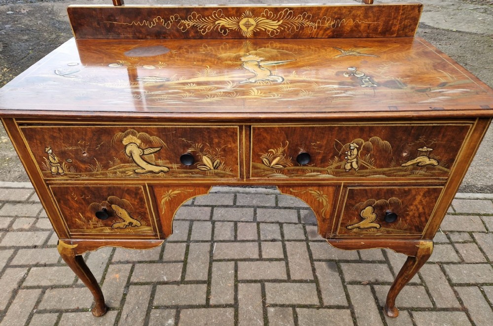 A four-piece Edwardian walnut bedroom suite featuring hand-painted Chinoiserie motifs, comprising a bedstead, wardrobe, dressing table, and chest of drawers with cabriole legs. View VII