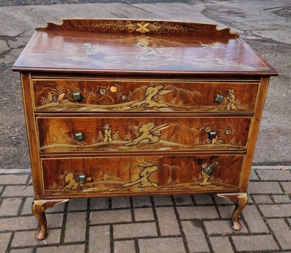 A four-piece Edwardian walnut bedroom suite featuring hand-painted Chinoiserie motifs, comprising a bedstead, wardrobe, dressing table, and chest of drawers with cabriole legs. View VIII