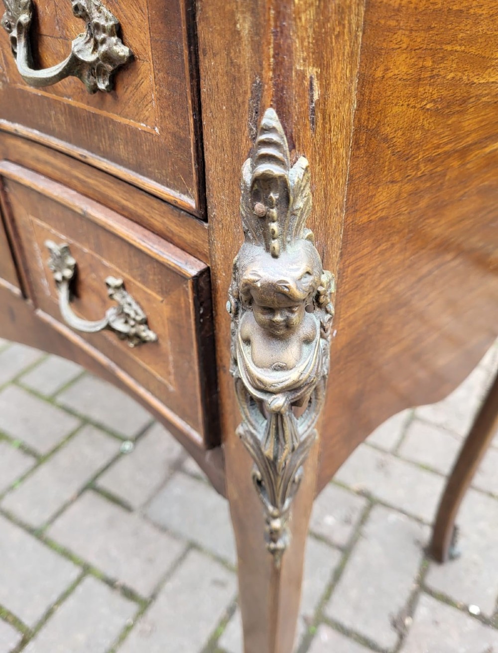 A French walnut poudreuse dressing table featuring a parquetry top, cabriole legs, ormolu mounts, and rococo drawer handles. View III