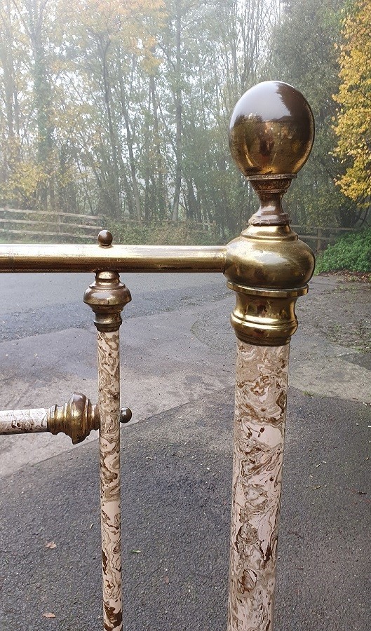 A Victorian brass and painted iron bedstead featuring turned vertical spindles, brass top rails, and spherical brass finials. View V