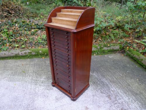 fig 1. A SUPERB 16 GRADUATED DRAWER COLLECTORS CABINET WITH CASCADE DISPLAY TOP. CIRCA 1880.