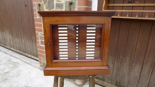 fig 1. A SUPERB QUALITY, SOLID MAHOGANY MEDAL COLLECTORS CABINET ATTRIBUTED TO MESSRS HOLLAND & SONS. CIRCA 1900.