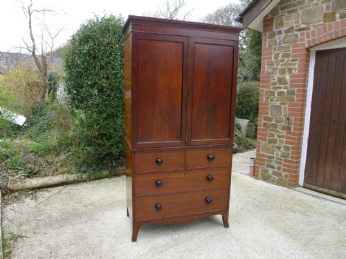 A Superb Solid Mahogany Linen Press Over Drawers Circa 1840
