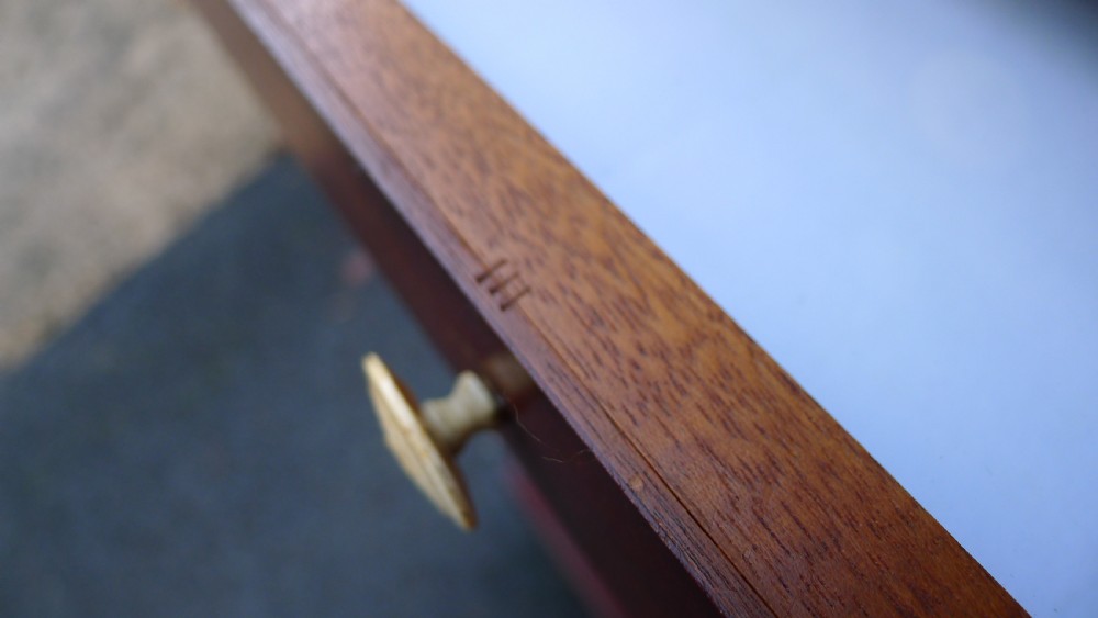 A nineteenth-century mahogany collectors cabinet featuring an open panelled door revealing multiple shallow drawers with light-coloured knob handles. View XI