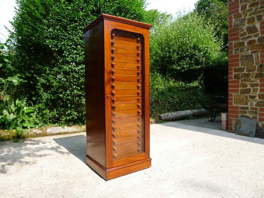 AN EXCEPTIONAL 20 DRAWER BUTTERFLY COLLECTORS CABINET BY CROCKETT OF CAVENDISH SQUARE. LONDON. CIRCA 1890.