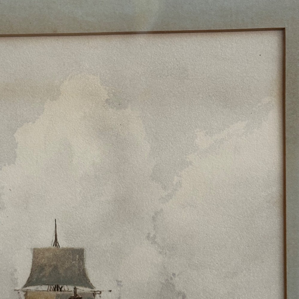 A pair of antique framed maritime prints featuring sailing vessels on calm waters framed in dark wooden moulding with gilt trim. View VI