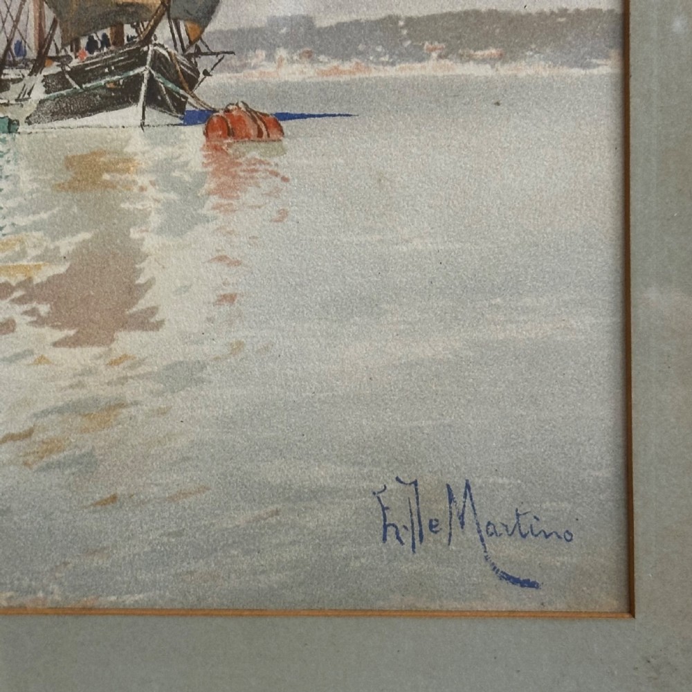 A pair of antique framed maritime prints featuring sailing vessels on calm waters framed in dark wooden moulding with gilt trim. View VII