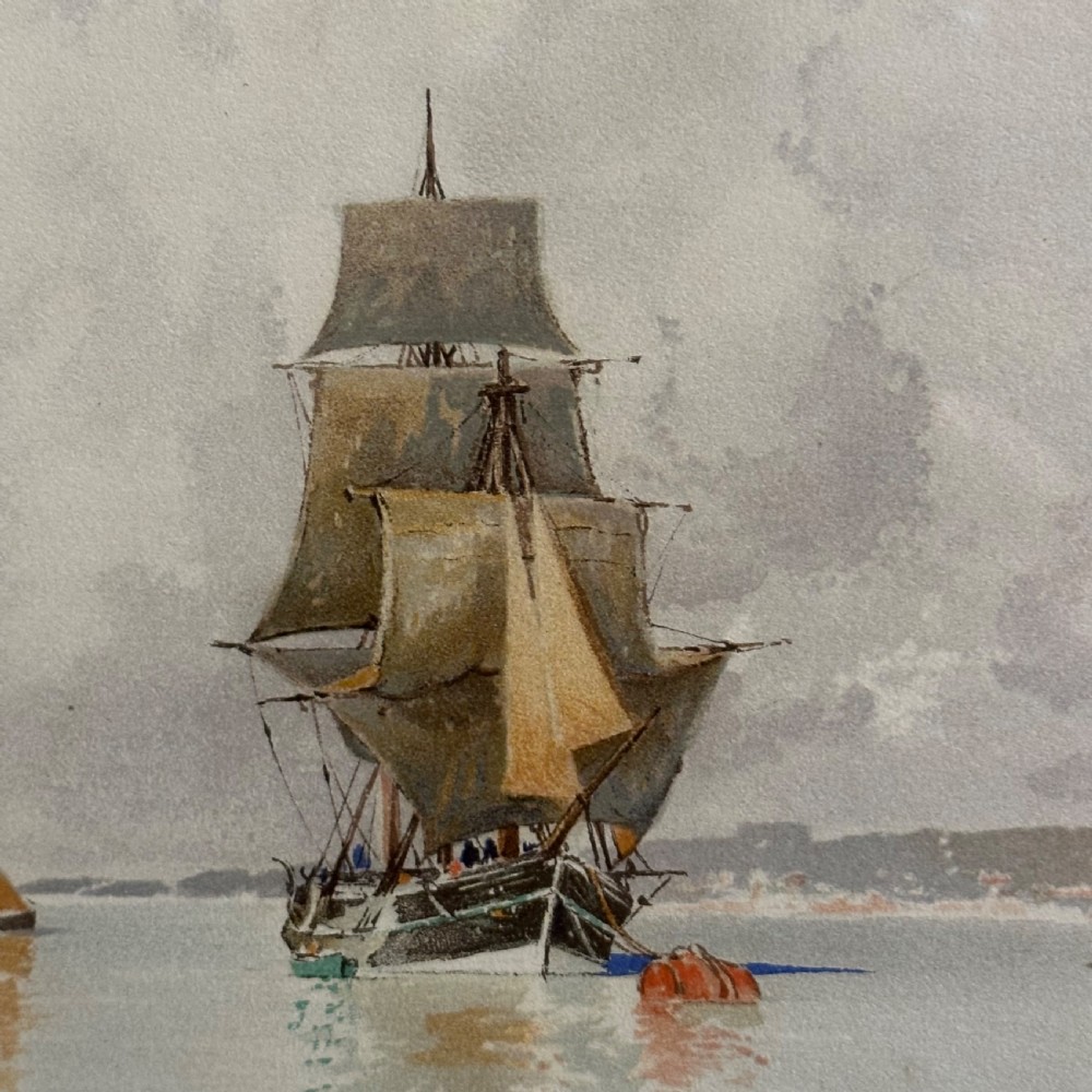 A pair of antique framed maritime prints featuring sailing vessels on calm waters framed in dark wooden moulding with gilt trim. View VIII