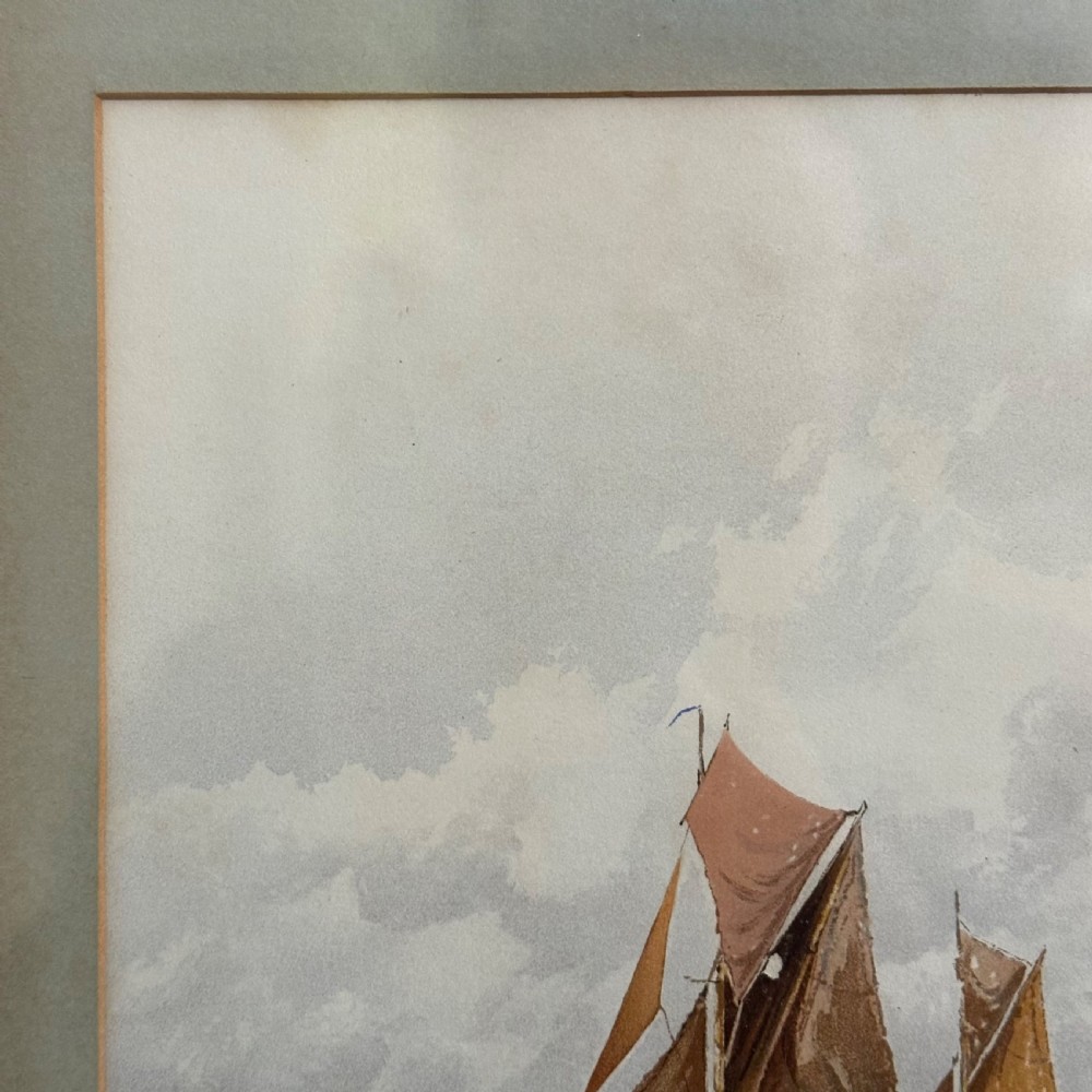 A pair of antique framed maritime prints featuring sailing vessels on calm waters framed in dark wooden moulding with gilt trim. View XIII