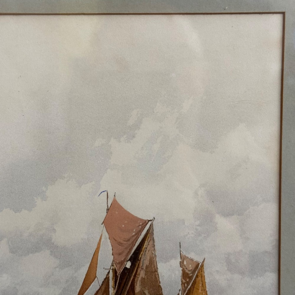 A pair of antique framed maritime prints featuring sailing vessels on calm waters framed in dark wooden moulding with gilt trim. View XVI